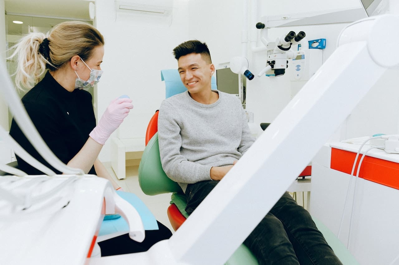 man smiling at dentist