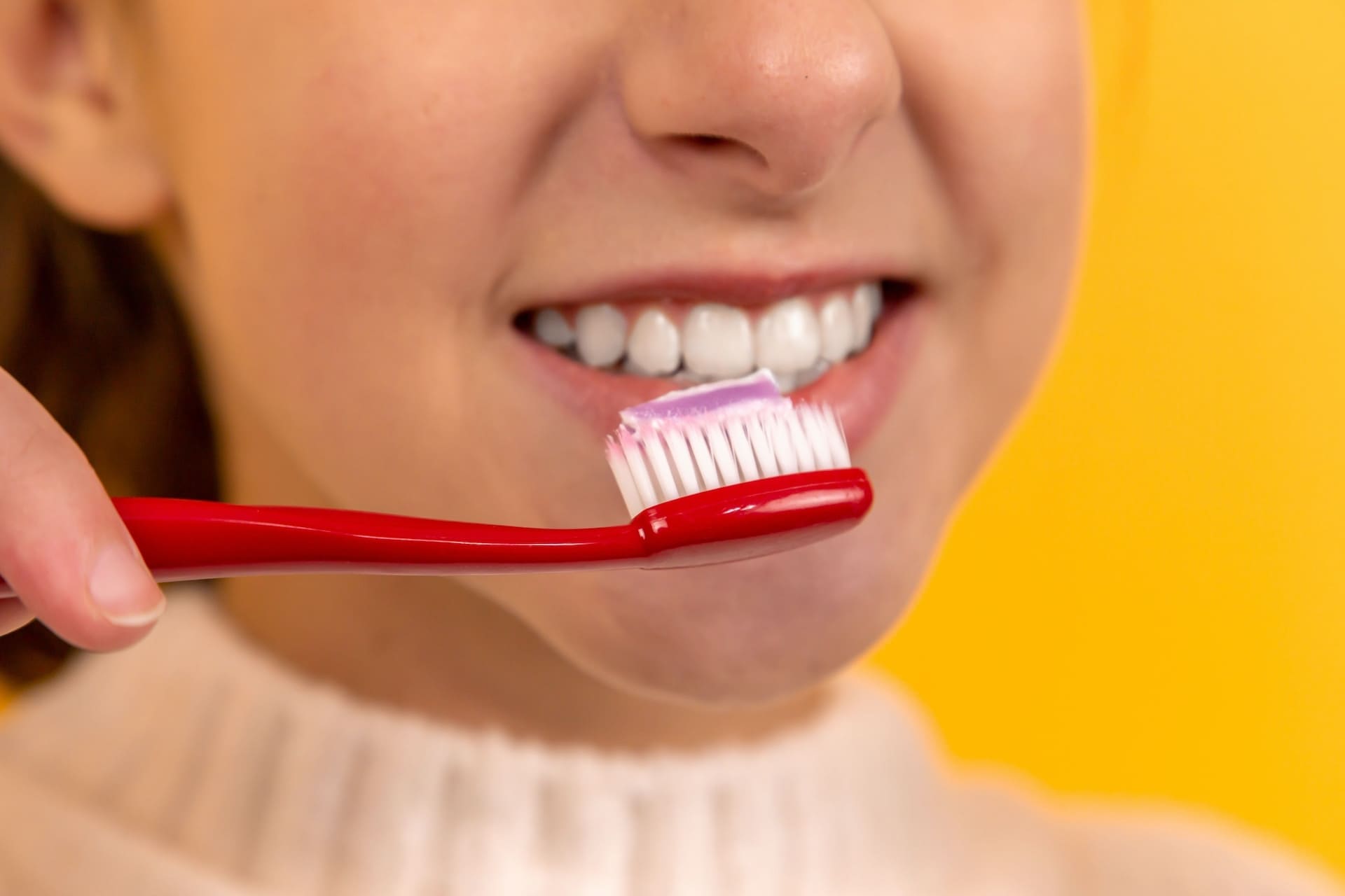 Girl brushing teeth