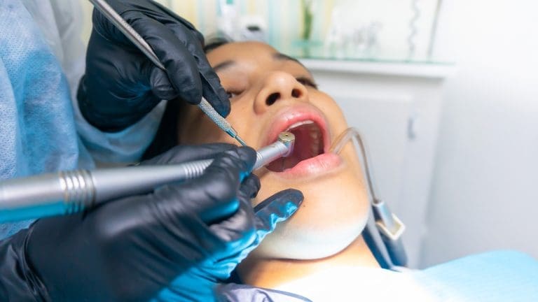 Patient receiving dental cleaning